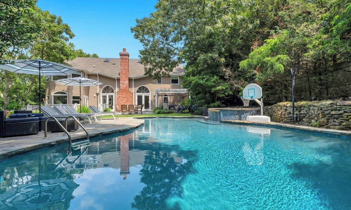 Tuckahoe House | Exquisite Southampton estate with a private heated pool and expansive.