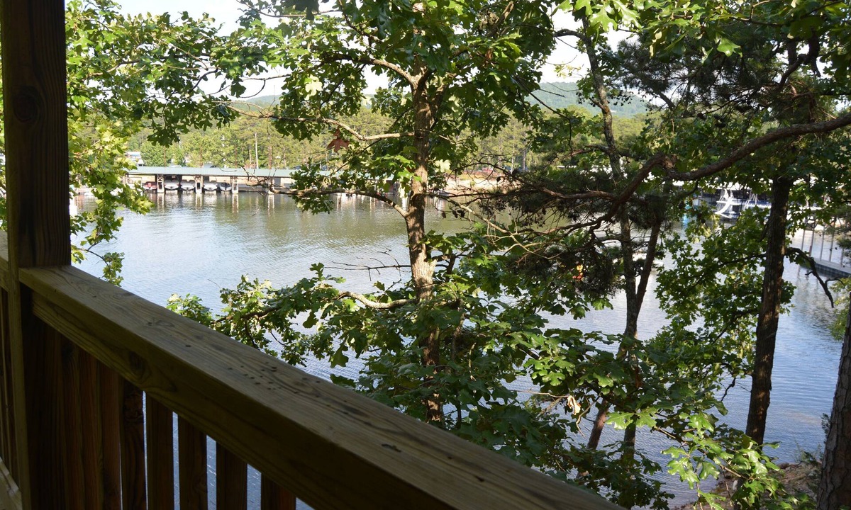 Mount Ida Cottage | Lake view two bedroom, two bath log-sided, luxury Harbor North loft cottage with hot tub overlooking Lake Ouachita. by RedAwning