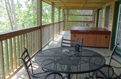 Mount Ida Cottage | C16, Two bedroom, two bath, log-sided Harbor North luxury cottage with hot tub overlooking Lake Ouachita. by RedAwning