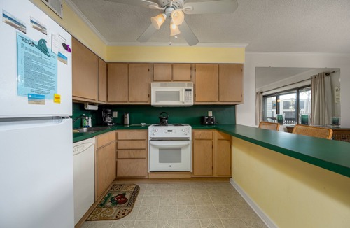 North Ocean City Condo | Charming 2 bed 2 bath condo featuring the ultimate private setting with wooded views that you can enjoy from your spacious deck.
