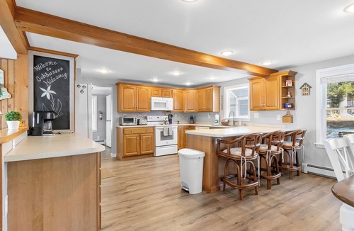 Winthrop House | Cobbossee Hideaway, lakefront property with dock for swimming, fishing, and sunrises