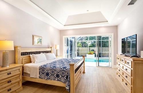 Naples Park House | Imola Vacation Rental - Remodeled Pool Home Minutes from Vanderbilt Beach! Family-Friendly Retreat with 4 BR 4 BA and Private Screened Pool!