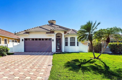 Naples Park House | Imola Vacation Rental - Remodeled Pool Home Minutes from Vanderbilt Beach! Family-Friendly Retreat with 4 BR 4 BA and Private Screened Pool!