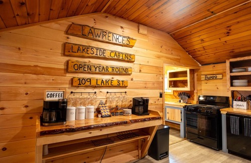 Northeast Somerset Cabin | Katahdin - Cabin 4 · Lawrence`s Lakeside Cabins | `Katahdin`: Boat Dock + Kayaks