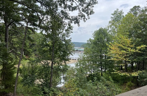 Mount Ida Cottage | Lake view three bedroom, three bath cottage with private hot tub overlooking Lake Ouachita. by RedAwning