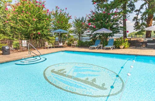 Mount Ida Cottage | Lake view three bedroom, three bath log-sided cottage with private hot tub overlooking Lake Ouachita. by RedAwning