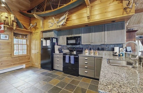 Greenville Junction House | Lakeside Lodge with Amazing Water Views, Screened Porch, Dock, & Firepit