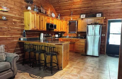 Mid America Cabin | Located directly on the water — private boat slip, boat ramp, and swim area.