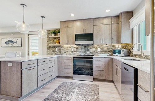 North Ocean City House | Luxurious oceanfront townhome with private deck and panoramic coastal views
