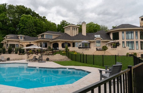Wernersville House | Overlook Retreat Villa is a luxury private estate on 100 scenic acres for up to 18 guests. Enjoy a pool, hot tub, game room, sports court, and sweeping sunset views that make you stop mid-sentence and create lasting memories!