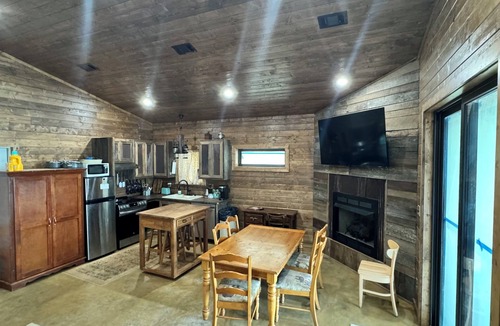Waveland Cabin | Paradiso sunrise waterfront cabin sleeps 10 with large open room and AC, WiFi