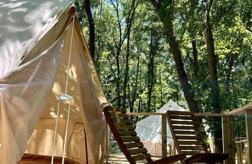 Gentry RV Rental | Peaceful Glamping Tents with Elevated Decks, Cozy Fire Pit, and Secluded Forest Views Near Gentry, AR