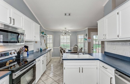 Chandelle First House | Private Getaway with Pool and Game Room in Pensacola 5 miles from beach.