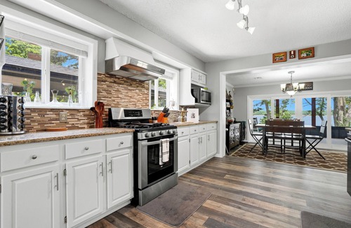 Wagoner House | Private Lakeside Cabin w/2-Slip Dock, Swim Deck, Hot Tub, & Screened Patio