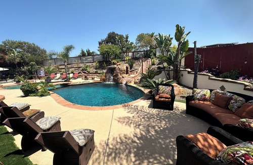 Oak Park House | Private oasis in backyard, beach entry solar heated pool, jacuzzi & water slide