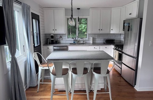 Hector House | Relax at this pet-friendly Wine Trail retreat featuring a private hot tub, fire pit, spacious deck, and fenced yard. Minutes from wineries, breweries, waterfalls, scenic hikes, and Watkins Glen.