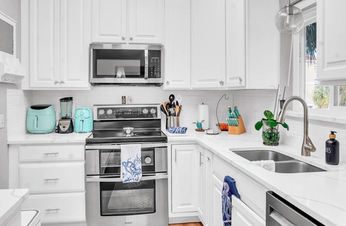 Navarre Beach House | Sleeps 10 with 8 beds! 2 minute walk to the Bay! Gulf access half a block away.