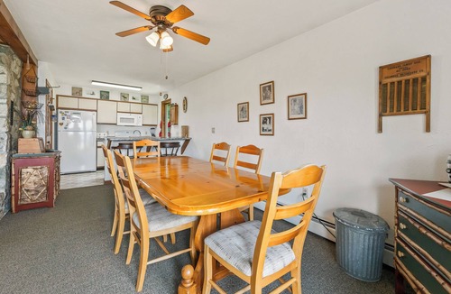 Rangeley Plantation House | Stone - This Rangeley Lake home has a very level entry to the water with a huge deck!