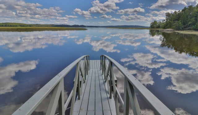 Bayfront home with gorgeous water views, dock, outdoor patio, fireplace