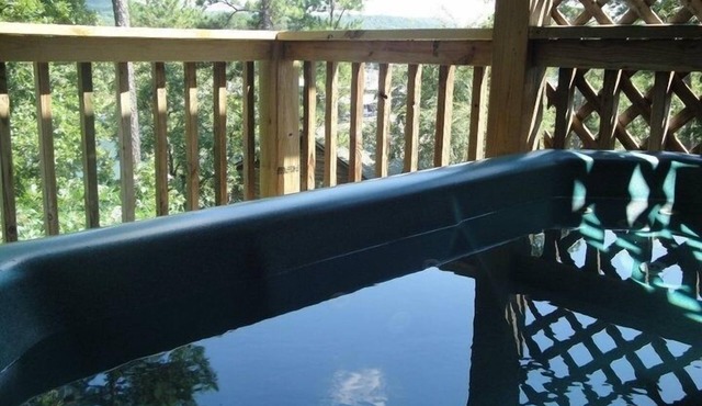 C16, Two bedroom, two bath, log-sided Harbor North luxury cottage with hot tub overlooking Lake Ouachita. by RedAwning
