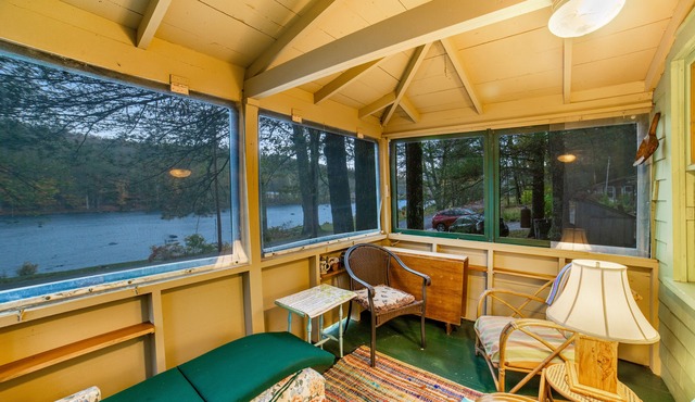 Classic riverfront cottage w/beautiful water views, WiFi, & screened porches