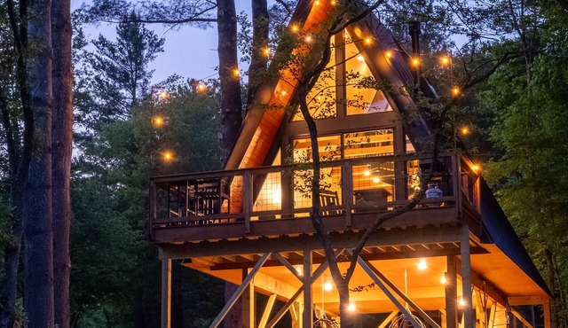 Designer A-Frame Treehouse with hot tub on river in Johnson