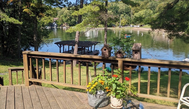 Direct lakefront cottage with wood burning fireplace in great room. Pet friendly