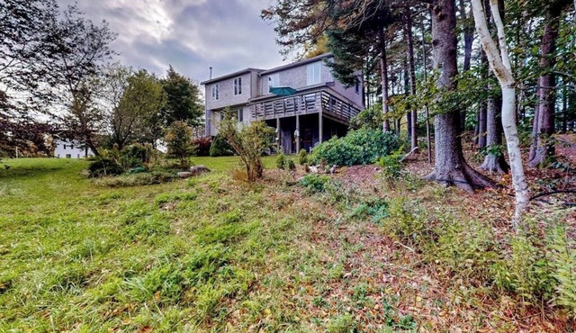 Dog-friendly 3-story home with wood stove, deck, grill, ocean views, W/D, AC