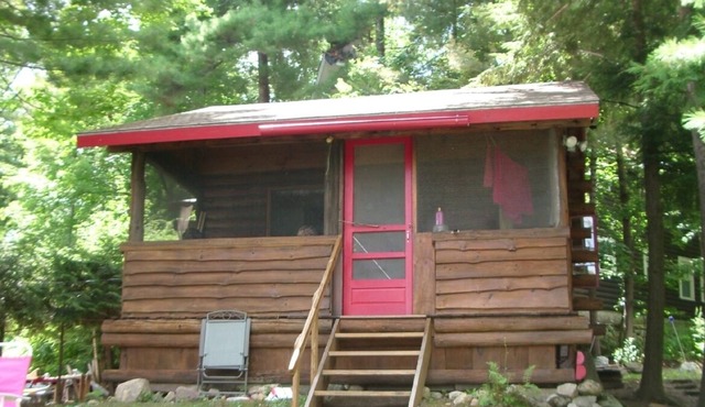 Enjoy a charming 1939 Log Cabin on gorgeous Lake George .
