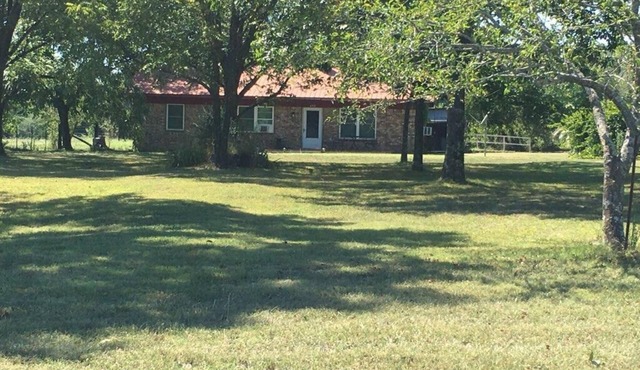 Great get away to a country home with large yard and outdoor sitting area.