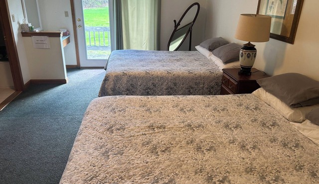 Hotel Room with 2 queen beds, sitting area, deck and large 2 person Jacuzzi tub