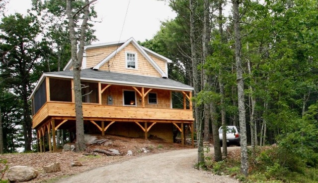 Picturesque Waterfront Cottage with Wraparound Screen Porch