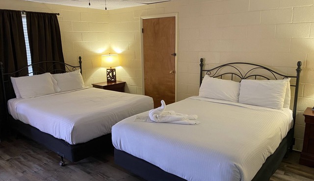 Queen Guest Room located at the Joplin Inn at the entrance to Mountain Harbor, just 2 1/2 miles from Lake Ouachita. by RedAwning
