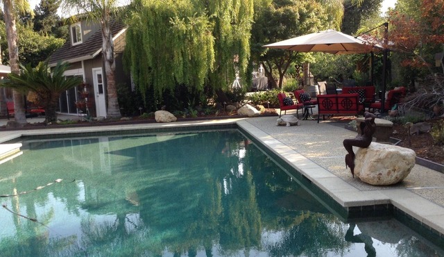 Relax surrounded by a garden and pool.